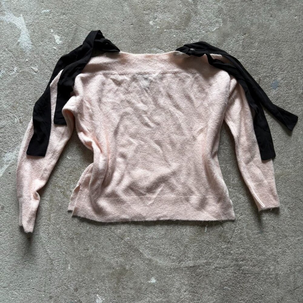 Pink and black bow tie off shoulder sweater